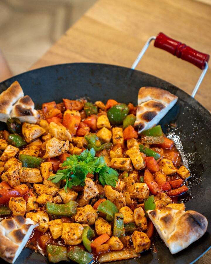picture of chicken saute served with pita bread